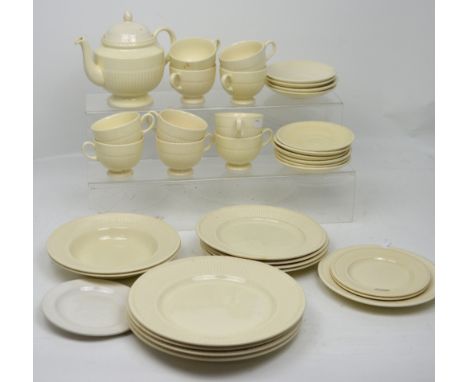 A cream Wedgwood part tea service to include plates, cups, saucers, teapot etc.