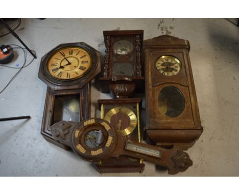 A station type wall clock, three further wall clocks and an oak barometer case, all in need of attention (5).