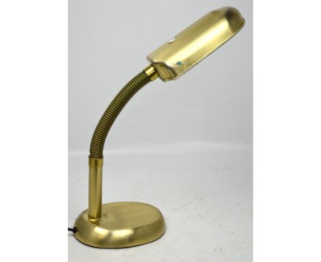 A yellow metal adjustable desk lamp.