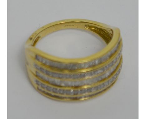 A 9ct yellow gold diamond set ring, set with five rows of alternating baguette and round cut diamonds, combined approx 1ct, s