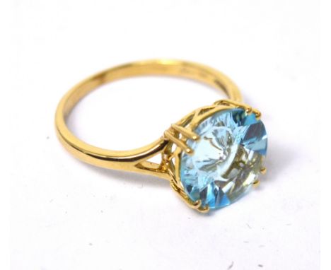 A 9ct yellow gold contemporary dress ring by Glen Lehrer set with central quasar cut blue topaz, with certificates, size P, a