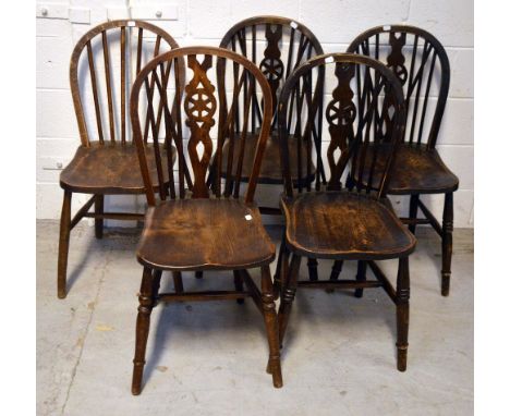 Four matching oak stick back kitchen chairs and a similar example (5).