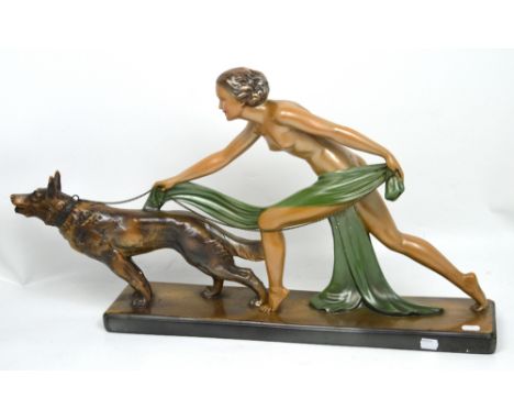 A large Art Deco figurine of a naked maiden with a wolfhound on a chain, length 73cm.