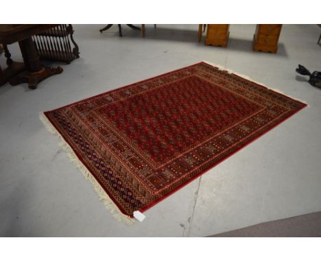 A red ground Bokhara carpet, 230 x 160cm.