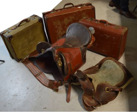 Two saddles and three vintage suitcases to include a canvas leather-mounted example, initialled 'J.F.' (5).