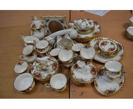 A quantity of Royal Albert 'Old Country Roses' part dinner and tea service to include dinner plates, side plates, cups, sauce