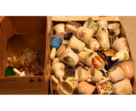 A large collection of decorative and commemorative bells in ceramic and glass and three Wade whisky bells (2).