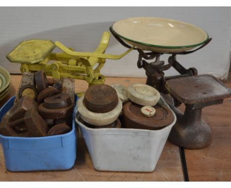Two pair of vintage scales and a large quantity of weights.