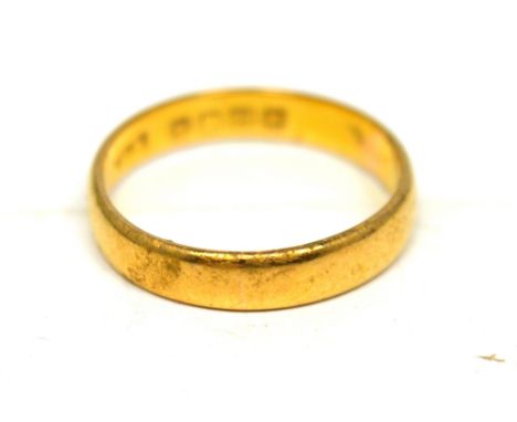 A 22ct yellow gold band, size L 1/2, approx 3g.