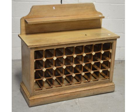 A modern pine freestanding wine rack, 90 x 97cm.