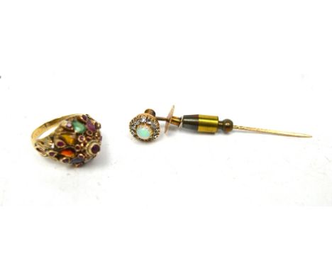 A Continental 18ct yellow gold ring set with various stones, size J 1/2, approx 4.9g and a boxed 9ct gold opal set stick pin 