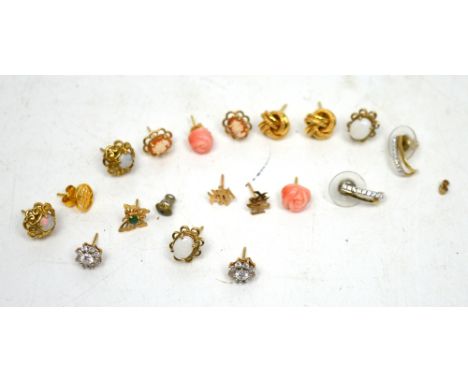 A quantity of gold and yellow metal earrings.