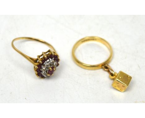 A boxed 9ct yellow gold band with dice charm and a 9ct yellow gold dress ring, approx combined 5.1g (2).