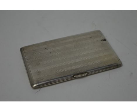 A George VI hallmarked silver engine turned cigarette case with gilt wash interior, G F B, London 1946, approx 6ozt.