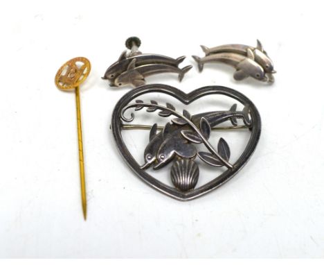 Arno Malinowski (1899-1976) for Georg Jensen; a silver openwork heart-shaped brooch enclosing dolphins, foliage and shell mot