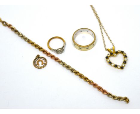 A 9ct gold heart-shaped pendant set with blue and white stones on a 9ct gold chain, a 9ct white and yellow gold ring, a 9ct g