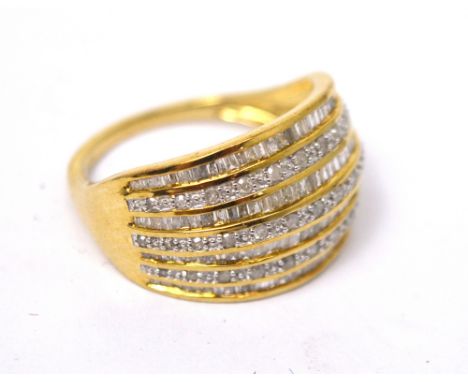 A large 9ct yellow gold dress ring set with a multitude of small diamonds in seven rows, size P 1/2, approx 4.3g.