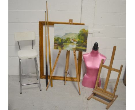 A collectors' lot comprising two artists' easels, a pink half-mannequin, decorative pictures, two pool or snooker cues and a 