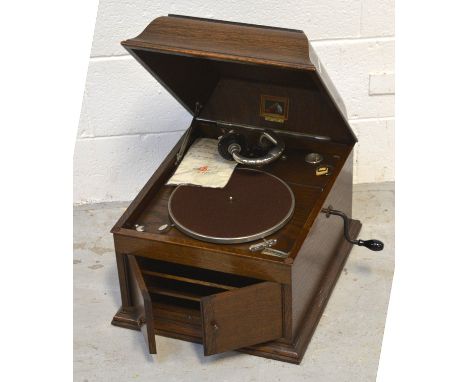 A wind-up 'His Master's Voice' Model 3 gramophone in an oak case, sold with original purchase receipt from 1925.