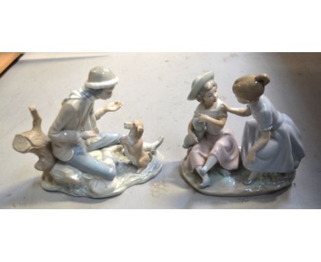 Two Nao figures; two young girls with a baby and a young boy playing with a dog (2).