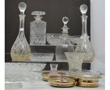 A pair of cut glass decanters, two further decanters, a quantity of glassware and a pair of hallmarked silver wine coasters a