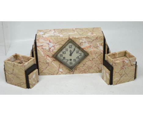 A 1930s French clock and garniture in typical stepped Art Deco form, the silvered rhombus dial set with Arabic numerals, the 