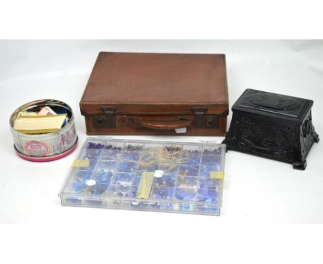A small vintage suitcase, a quantity of vintage buttons in tins and a Perspex case of various beads.