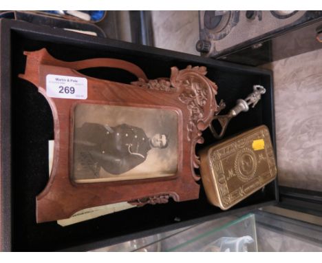A World War I carved wood photo frame, carved verso Friedrichsfield 1914-1918 with photo portrait of a soldier signed Corp. T