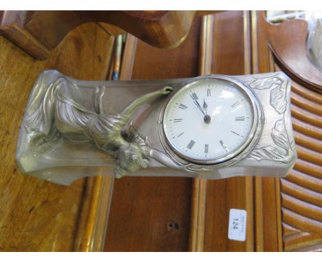 A pewter Art Nouveau table clock, of rectangular form with a lady holding aloft the dial, stamped Fschille Gamba and G.S.W. N