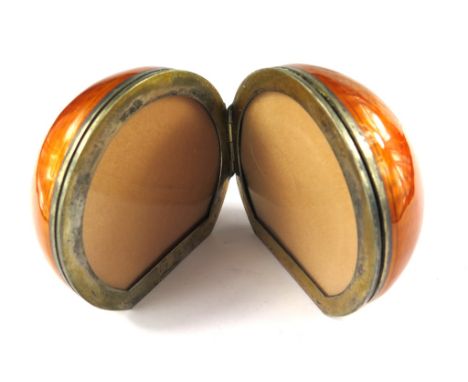 A double photo frame in the form of a silver and enamel ball