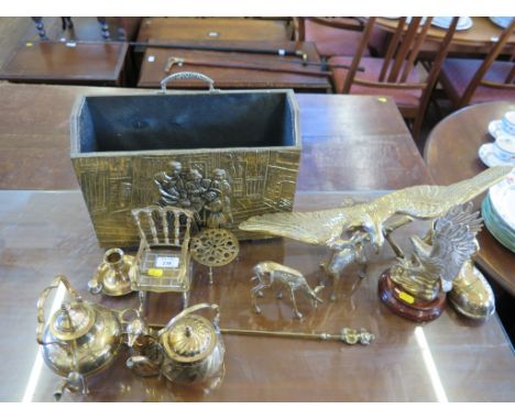 Two brass figures of eagles, a toasting fork and various other brass ornaments 