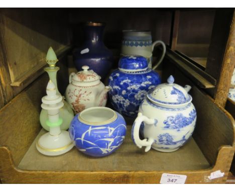 A Chinese blue and white teapot depicting a fisherman on a bridge, unmarked, 15cm high, another Chinese teapot, as found, a c