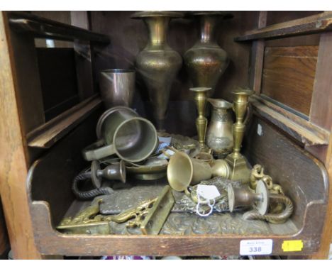 A brass 'Chester Imp' door knocker, a pair of brass candlesticks, and other brasswares