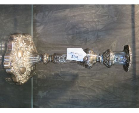 A single silver Georgian candlestick of Rococo style