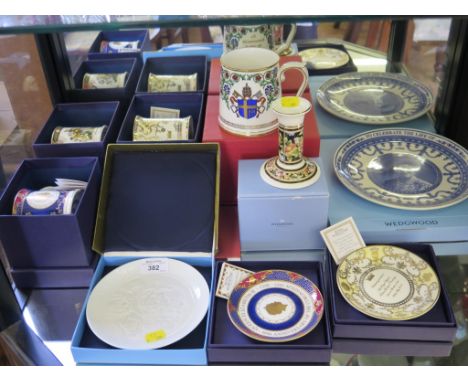 Three Royal Worcester commemorative mugs and two commemorative saucers, all boxed, a Wedgwood plate, a Papal commemorative ta