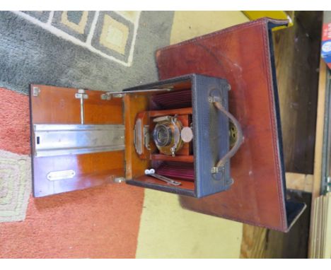 A Cycle Wizard C.Jr plate camera with brown leather bellows, in a Ross Ltd leather plate camera case and a Calidor light mete