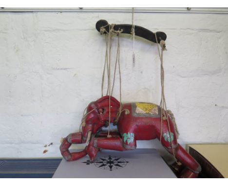 An Indian marionette puppet in the form of a red elephant, 30cm high