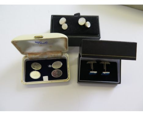 Three cased sets of silver and enamel, silver mother of pearl studs and silver  cufflinks, Birmingham 1967