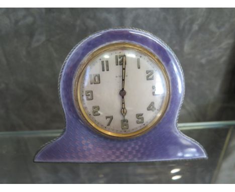 A silver and mauve enamel bedside clock fitted with eight day movement (not working) 