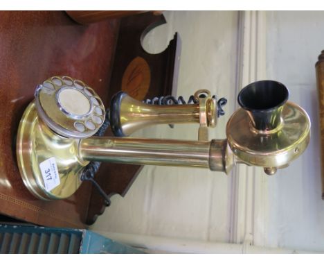 A brass stick telephone 31.5cms high, with modern wiring 