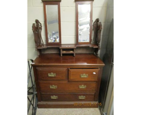 WALNUT TRIPLE MIRROR BACK DRESSING CHEST WITH TWO OVER TWO FULL WIDTH DRAWERS WITH DECORATIVE BRASS HANDLES  