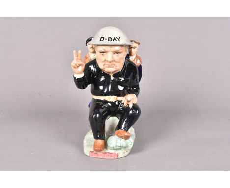 An Artist proof ceramic jug by John Michael for Kevin Francis, entitled 'Overlord', seated Churchill in black uniform with D-