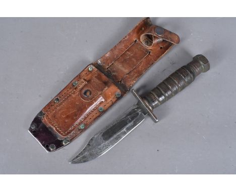 A Vietnam-era Camillus fighting knife, marked and dated Camillus U.S 2-1971, with 12.5cm long single edged, single fullered s