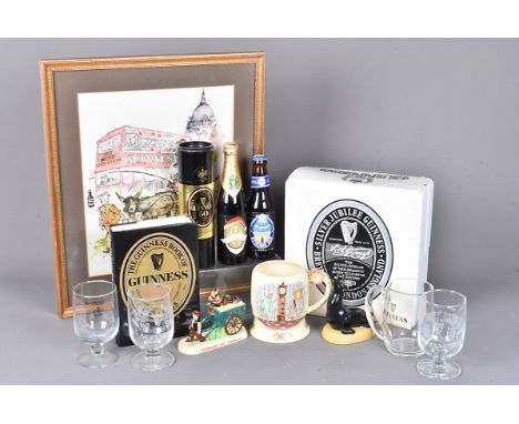 A large collection of Guinness memorabilia, comprising numerous bottle with various designs, including Limited Edition exampl