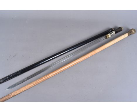 An Indian sword stick, the decorative ebony stick, with twist collar release, to reveal a 61cm long blade, together with a ba