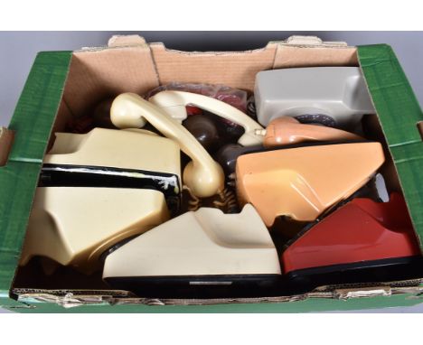 A group of vintage telephones, all rotary examples, in different colours, cream, yellow/orange, red and grey (parcel)