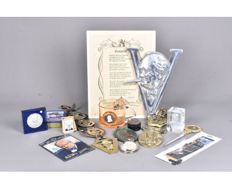 An assortment of Churchill related items, to include brass door knocker, badges, coins, cufflinks, souvenir spoons, plaques, 