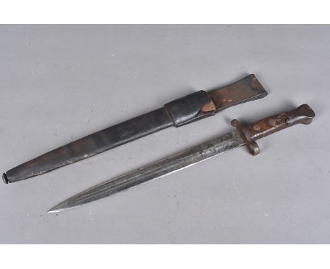 An early British Lee Metford bayonet and scabbard, the double edged blade marked with a crowned VR, also marked 10/92, with b