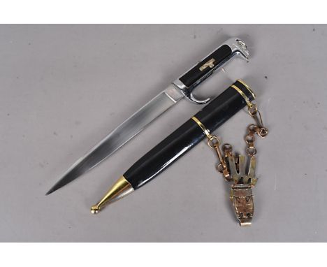 An Italian MVSN dagger, with eagle pommel, with cartouche to the grip, 19.5cm long single edged blade, unnamed, complete with