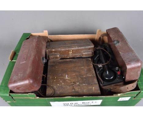 Three vintage field telephones, including two rotary examples, together with a GPO 4GPO G54/11 and a box of spares (parcel)
